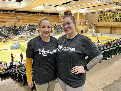 Two alumni at Chap basketball game