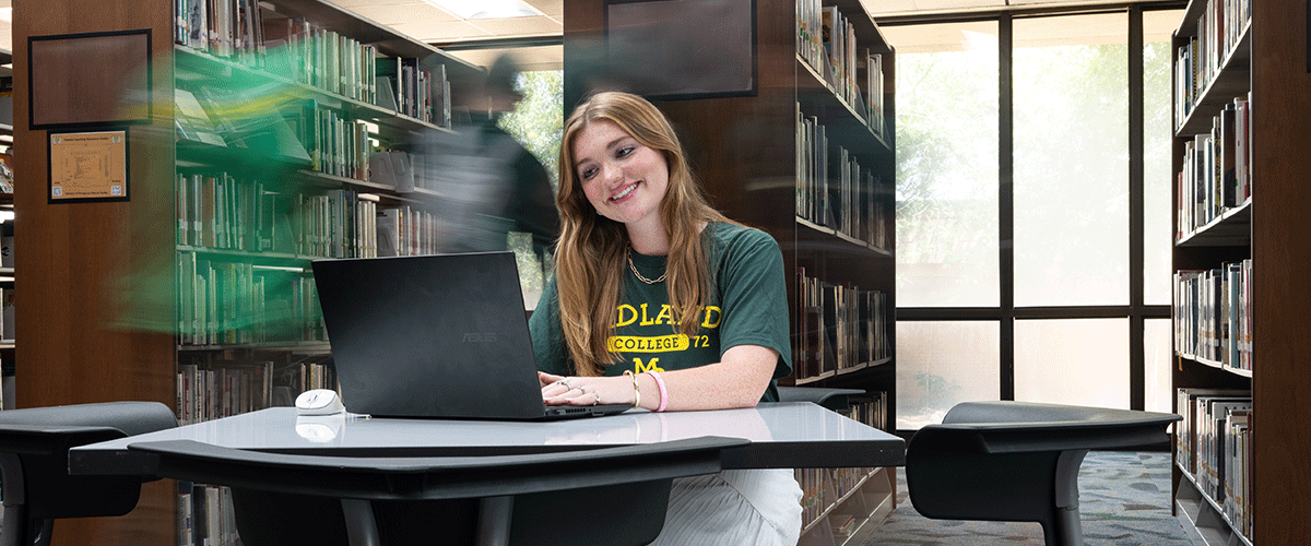 Midland College student working on a laptop