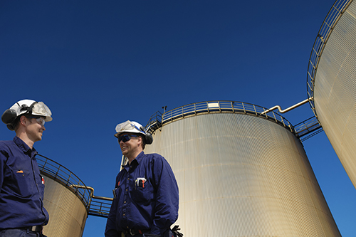 Energy Technology professionals in a tank farm