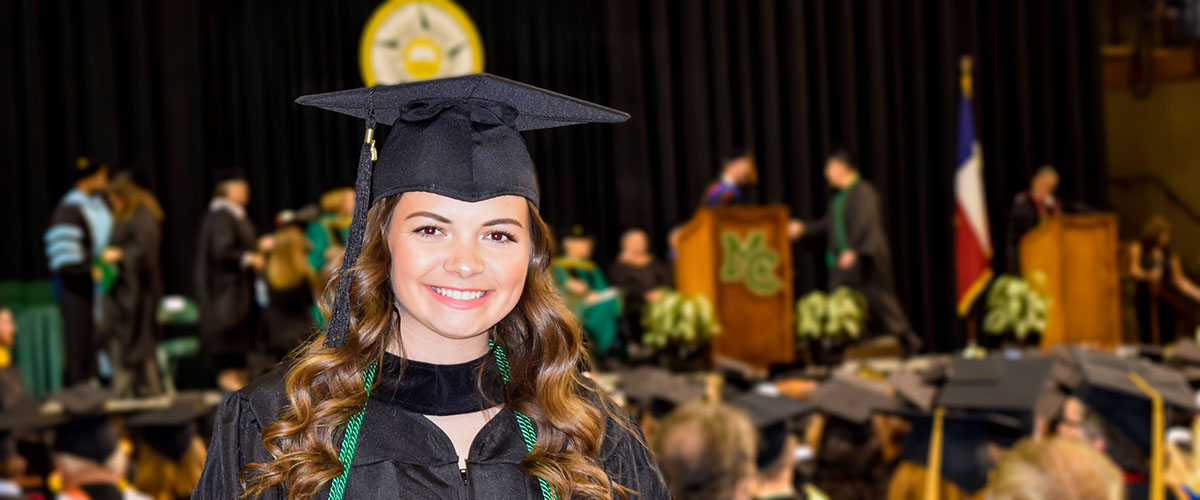 Graduate holding diploma