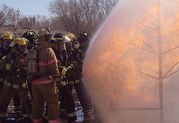 Fire Science students practicing a drill at the training fire field