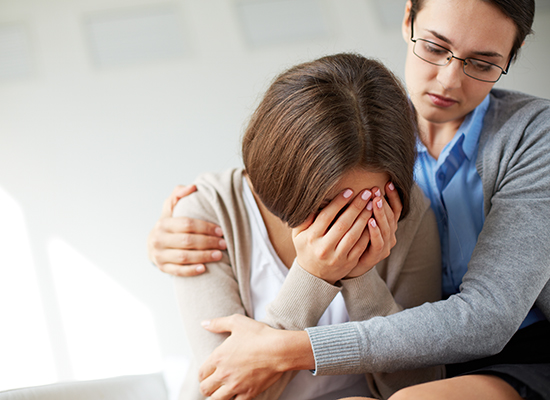 Psychologist comforting a patient