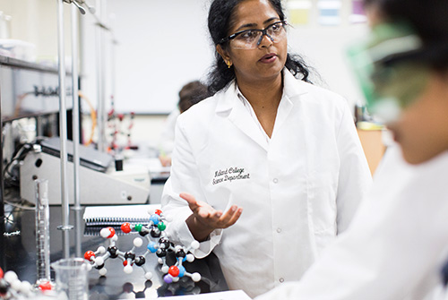 Chemistry instructor and students in laboratory