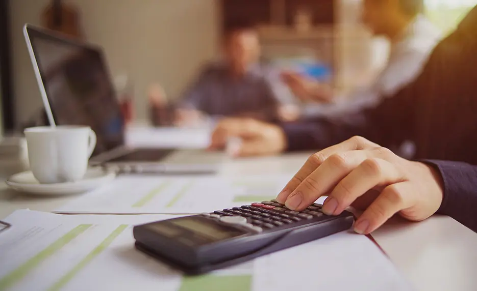 Person working on calculator