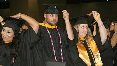 MC graduates moving the tassle