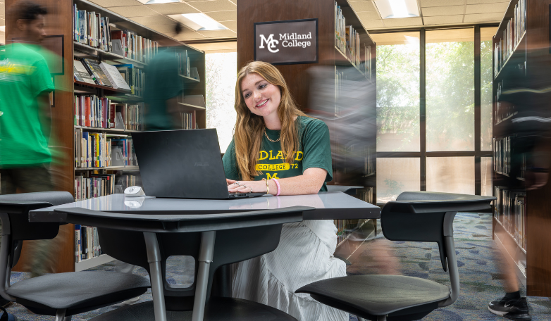 student studying while people zoom by