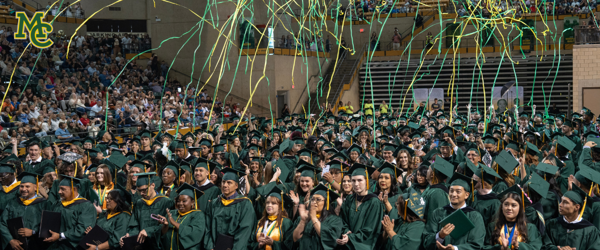 students celebrating graduating