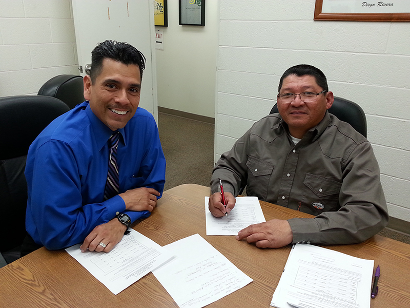 sAlfredo Chaparro, director of the Midland College BEDC, assists a client with a small business loan application.