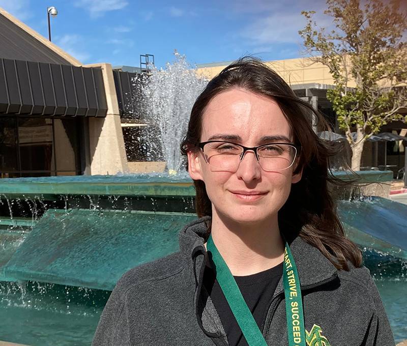 The image to use for this article. Listing image managed through RSS tab. Brittany Brown in front Scharbauer Student Center fountain