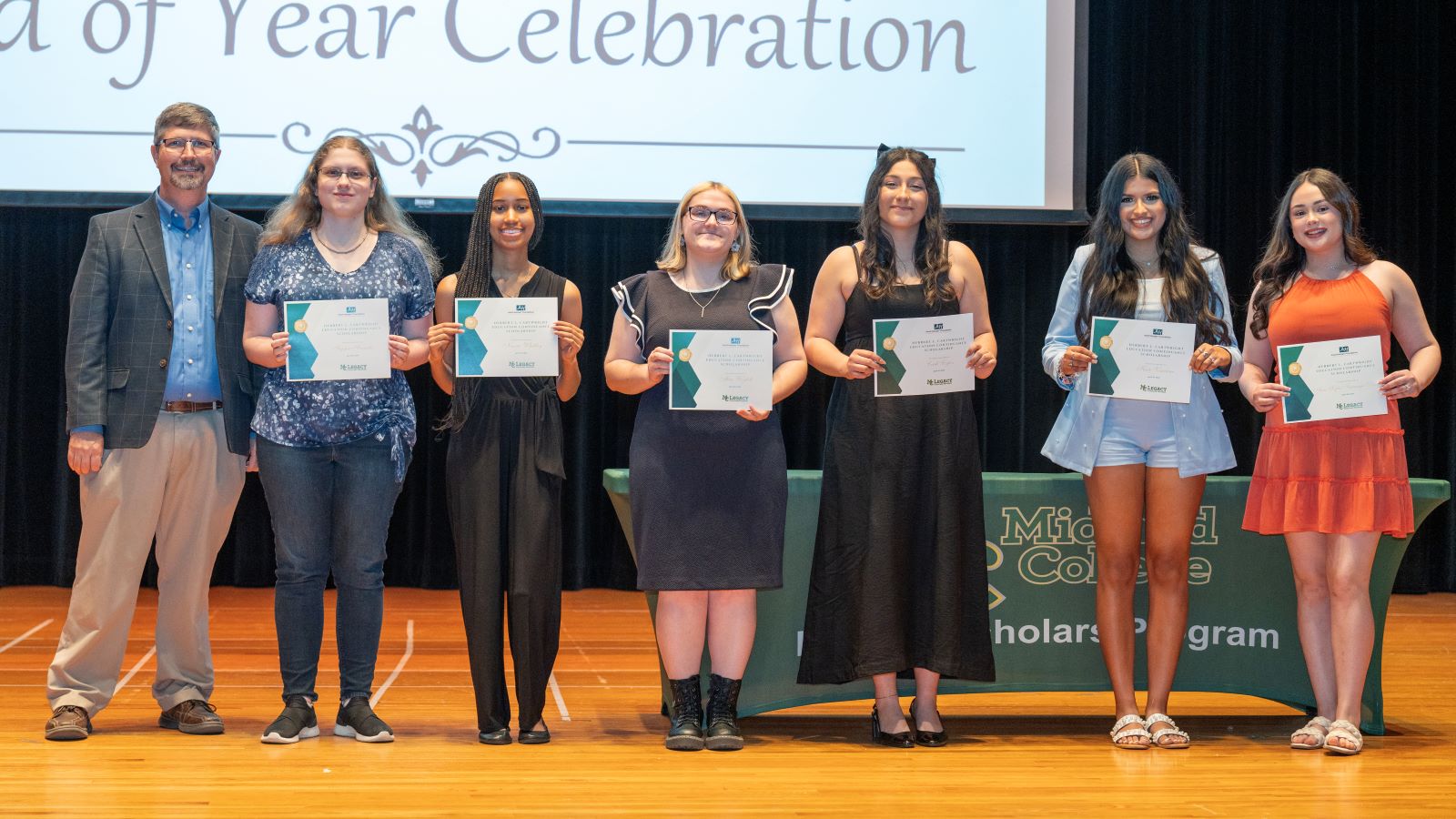 The image to use for this article. Listing image managed through RSS tab. Legacy Scholars students pose with CEO of Abell-Hanger Foundation