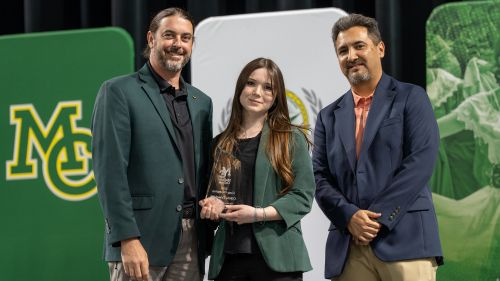 smidland college president dr. damon kennedy poses with 2026 chap champion Olivia Trischitti and MC vp of instruction Dr. Frank De La O