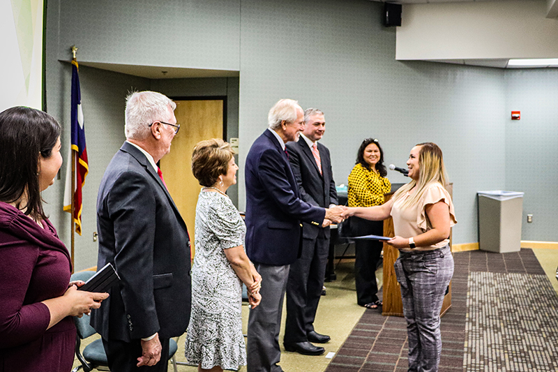 The image to use for this article. Listing image managed through RSS tab. Dr. Steve Thomas shakes hands with Damariss Carrasco.