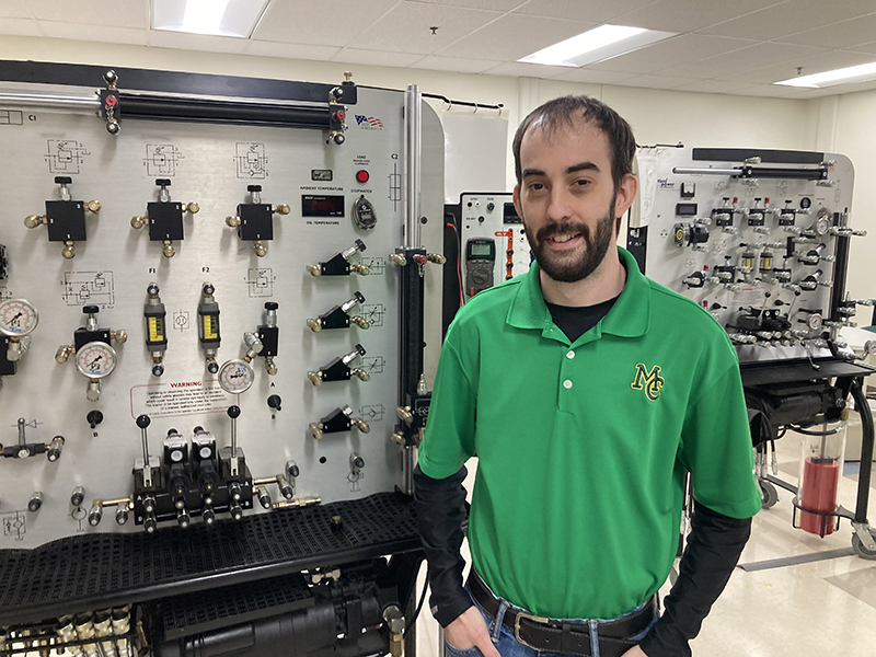 The image to use for this article. Listing image managed through RSS tab. Anthony Cummins standing in front of Energy Technology lab equipment at the MC Advanced Technology Center.