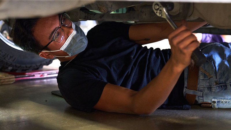 The image to use for this article. Listing image managed through RSS tab. Diesel Technology student working with wrench.