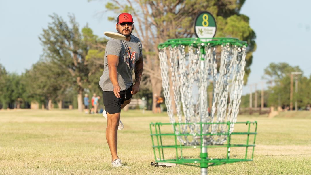 smc community member plays disc golf on new MC course