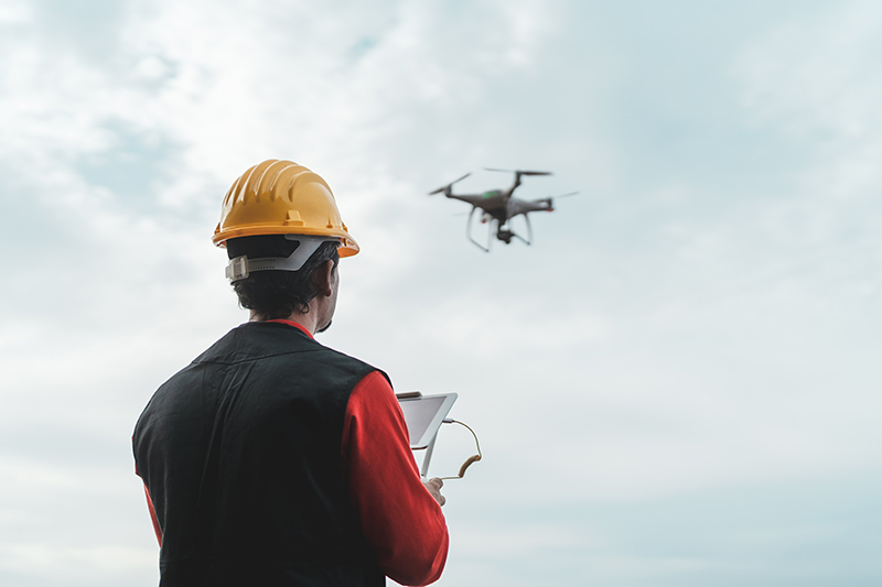 sPerson flying a drone.