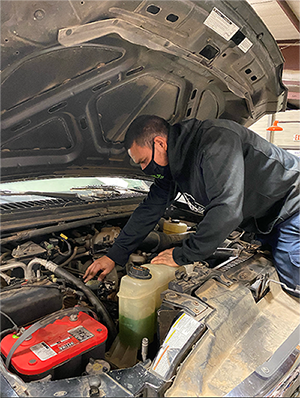 The image to use for this article. Listing image managed through RSS tab. Jimmy Espinoza working on a diesel engine in the Midland College Diesel Technology lab.