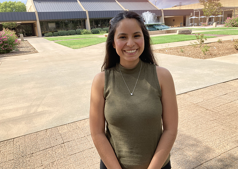 The image to use for this article. Listing image managed through RSS tab. Diana Garcia Garcia standing near Scharbauer Student Center fountain.