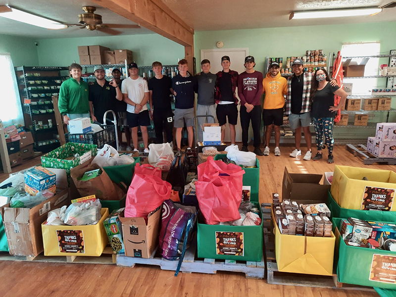 The image to use for this article. Listing image managed through RSS tab. Golf Team delivering food to Jubilee Center