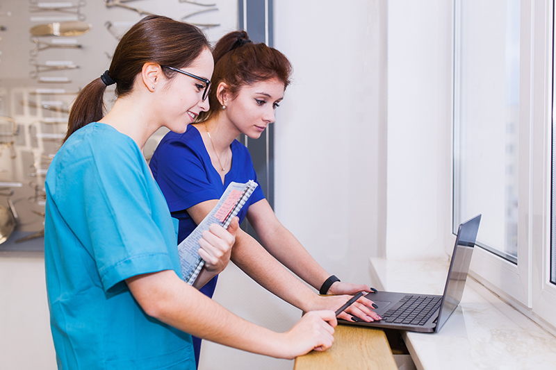 The image to use for this article. Listing image managed through RSS tab. Two females in scrubs at computers