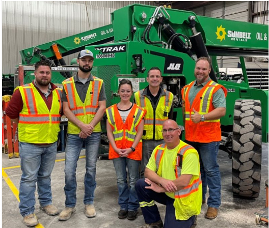 sJessy Hills (center) with employees of Sunbelt Rentals Branch #425, 2611 E Interstate 20 in Midland.