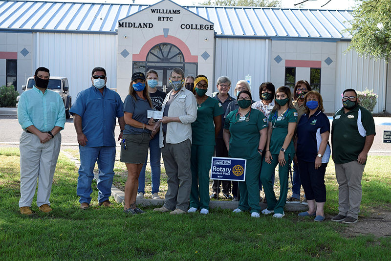 The image to use for this article. Listing image managed through RSS tab. Pam Palileo, Ft. Stockton Rotary Club president, presents check to Jack Williams, Midland College WRTTC Vocational Nursing instructor.  Also pictured are members of the Ft. Stockton Rotary Club, WRTTC staff and current vocational nursing students.