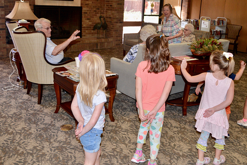 The image to use for this article. Listing image managed through RSS tab. Children and residents interact at Manor Park