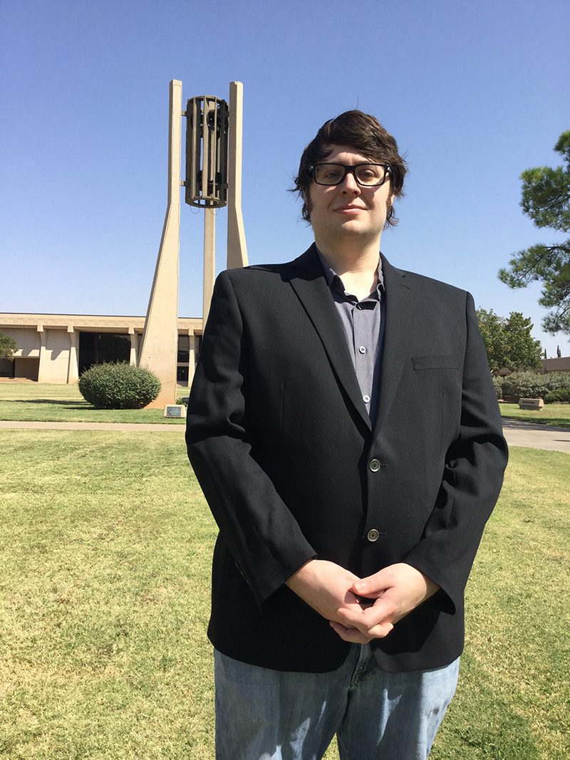 The image to use for this article. Listing image managed through RSS tab. Stephen McDonald standing in front Hodge Carillon on MC campus