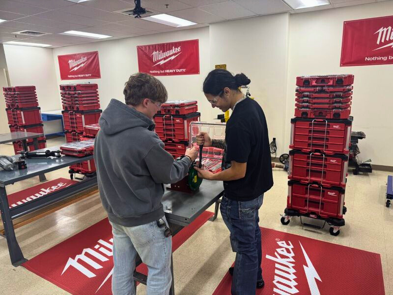 sTwo midland college students inspect the new Milwaukee Tool pieces that were recently donated.