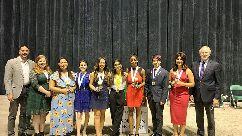 sMidland College Vice President of Instructional Services Dr. Damon Kennedy (left) and Midland College President Dr. Steve Thomas (right) with Midland College Phi Theta Kappa 2021-2022 chapter officers from left to right:  Elizabeth Whitten, Ana Chilcoat, Marisol Tarin, Shaquila Sarapao, Hena Patel, Mariam Athumani, Caleb Golliandeau and Zada Kadir.