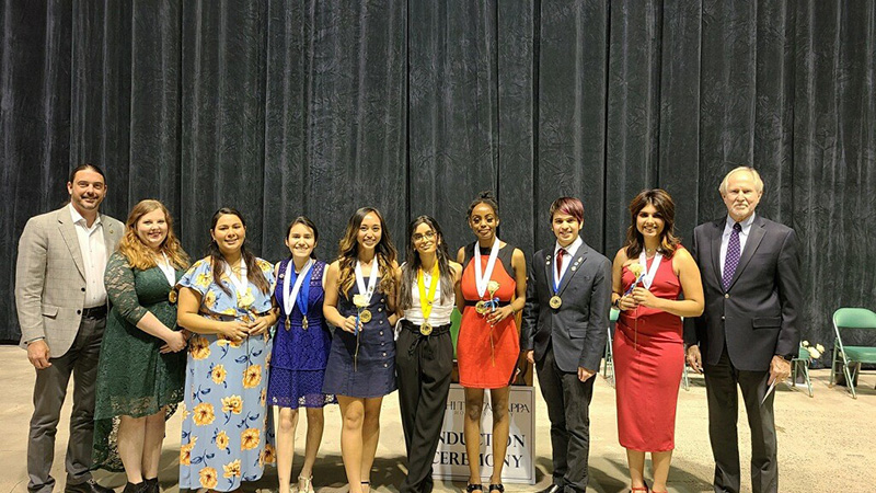 The image to use for this article. Listing image managed through RSS tab. Midland College Vice President of Instructional Services Dr. Damon Kennedy (left) and Midland College President Dr. Steve Thomas (right) with Midland College Phi Theta Kappa 2021-2022 chapter officers from left to right:  Elizabeth Whitten, Ana Chilcoat, Marisol Tarin, Shaquila Sarapao, Hena Patel, Mariam Athumani, Caleb Golliandeau and Zada Kadir.