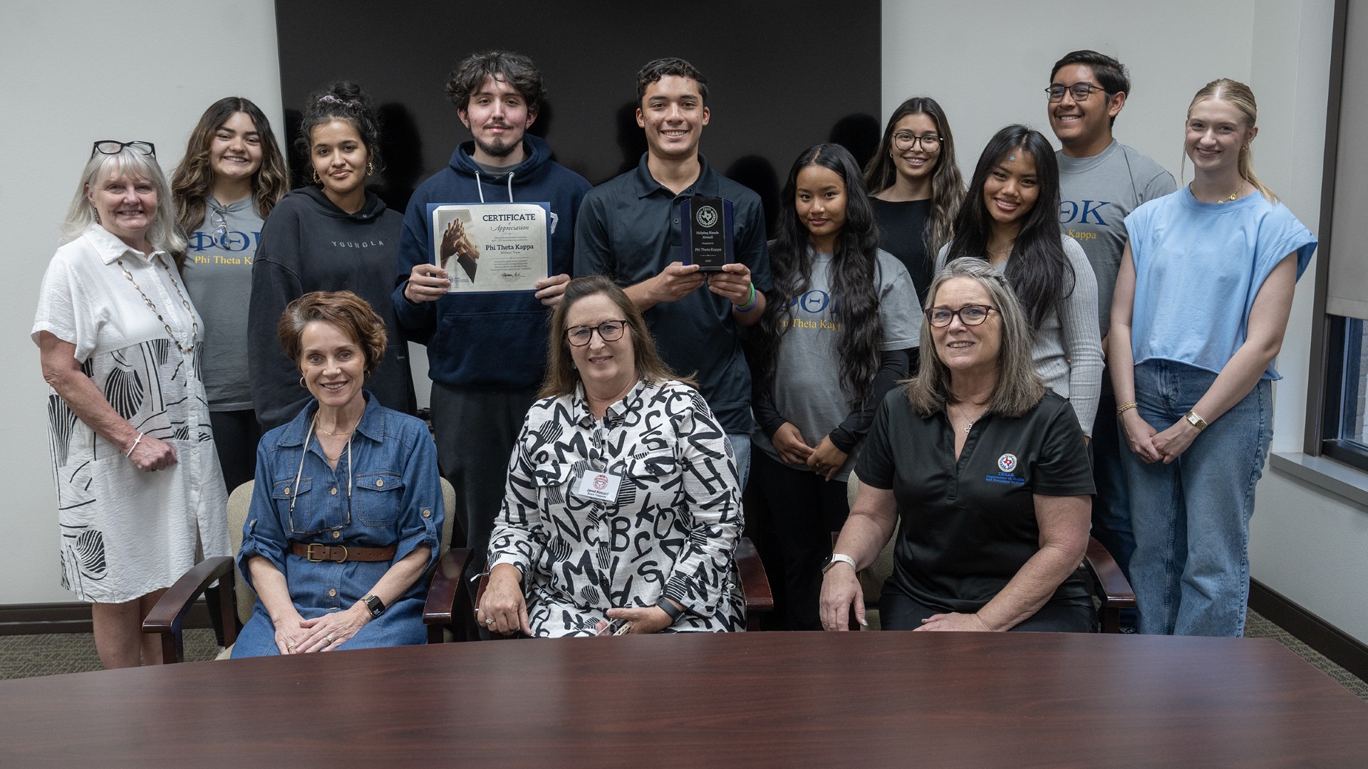 sptk students pose with adult protective service reps in acceptance of award