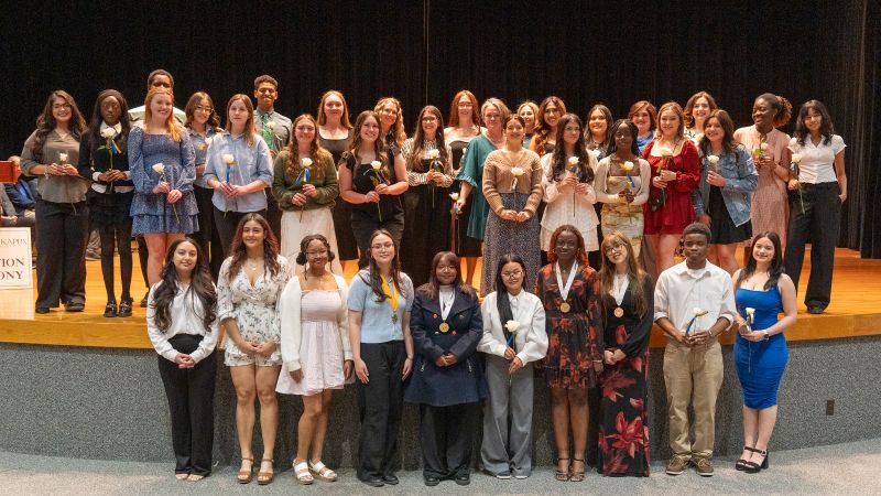 The image to use for this article. Listing image managed through RSS tab. 31 students pose in the Allison Fine Arts building during the induction ceremony.