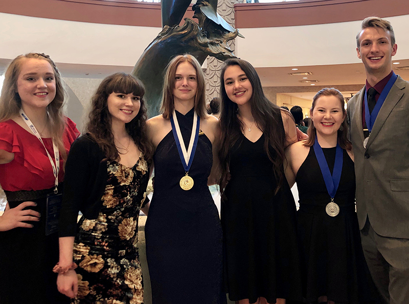 The image to use for this article. Listing image managed through RSS tab. MC students attending Phi Theta Kappa Catalyst International Conference in Orlando, FL.  Pictured from left to right:  Anna Lien, Ruby Stuard, Dusty Ellis, Madeline Flores, Tatum Dotson, Jacob Edwards