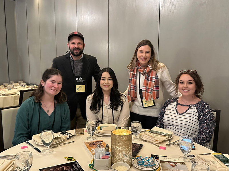 The image to use for this article. Listing image managed through RSS tab. Midland College students and advisors at Sigma Tau Delta National Convention awards luncheon.  Front row, left to right, Abigail Hightower, Sadie Fuentes, and Brycie Tamayo. Back row, advisers Brendan and Stacy Egan.