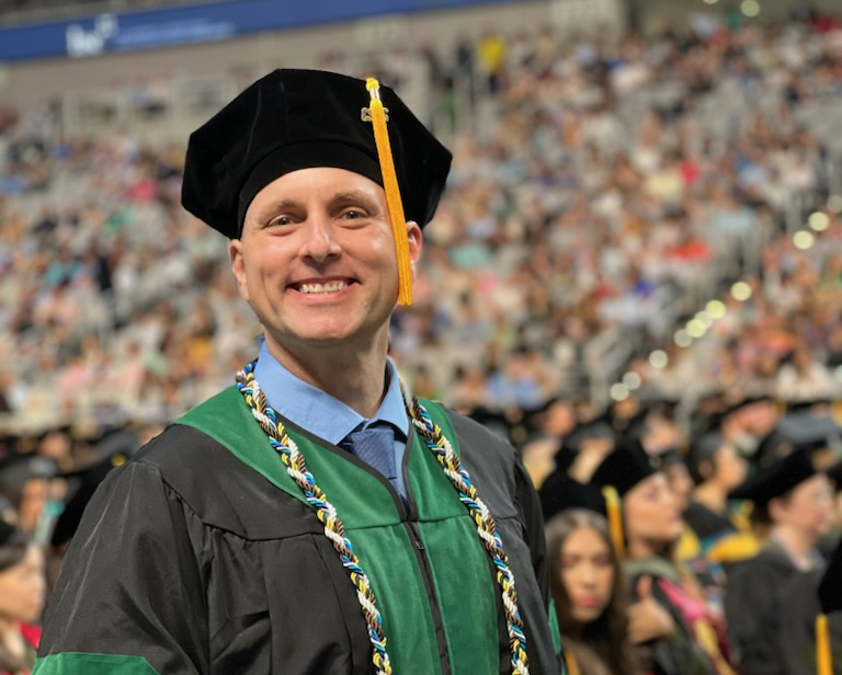 sClarence Sparks in Texas College of Osteopathic Medicine graduation regalia.