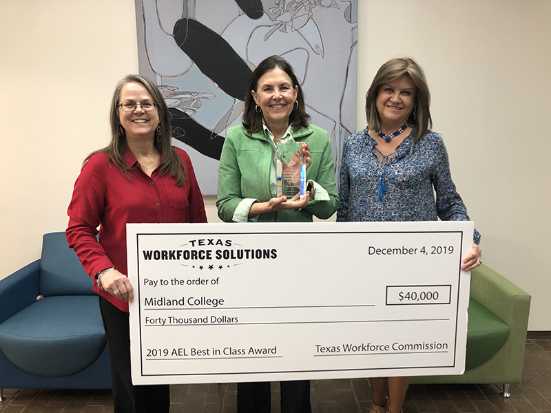 The image to use for this article. Listing image managed through RSS tab. Valerie Hall, Lynda Webb and Luisa Nail with award from Texas Workforce Commission