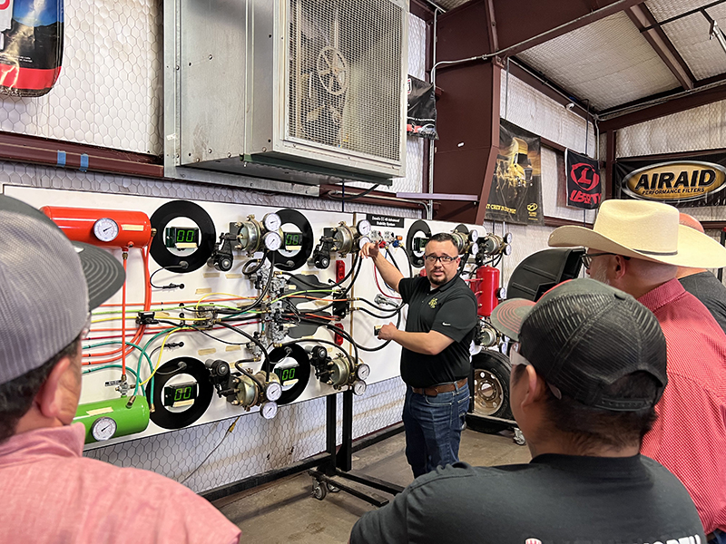 sMidland College Diesel Technology Professor Erick Gutierrez explains airbrake systems to Universal Pressure Pumping technicians using state-of-the-art simulated equipment in the Midland College Diesel Technology lab on Wednesday, June 28.